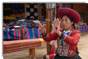 Sthefany Huanca from Centro Textil Andina — Kuska Away Yachak demonstrates the natural deep red of cochinilla