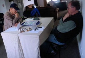 Ben Withers, TX, and Bob Linn, MD, face off in the opening round of TWL play in the Peru Tour &amp; Scrabble® competition in Lima, Peru.