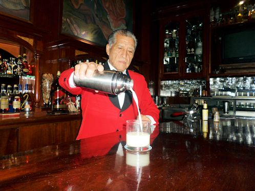 Visitors from all over the world — American, French, Spanish, Chinese, Canadian —  make it  a point to take a break during their  tour of Lima to stop by the Maury bar and have one its legendary Pisco Sours, mixed by Eloy Cuadros.