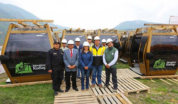 Minister of Commerce and Foreign Trade Magali Silva and officials from Telecabinas Kuelap S.A. celebrate the arrival of cable cars to tramway to Kuelap.
