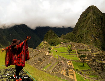A visitor extols the view overlooking the Machu Picchu Sanctuary on the day of the Southern Hemisphere's Summer Solstice, Friday, Dec. 21, 2018