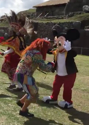 Mickey Mouse looking spry for an 88-year-old rodent, as he participates in a traditional dance on the esplanade of Sacsayhuaman, in Cusco, Peru