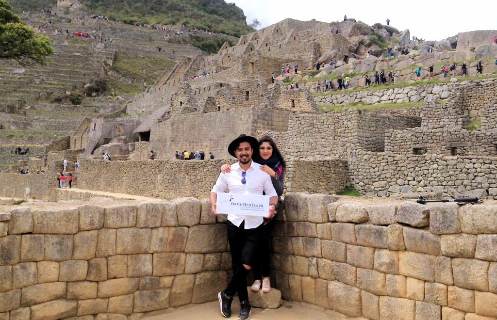 Newlyweds enjoying Machu Picchu as the crowning jewel of their honeymoon in Peru.