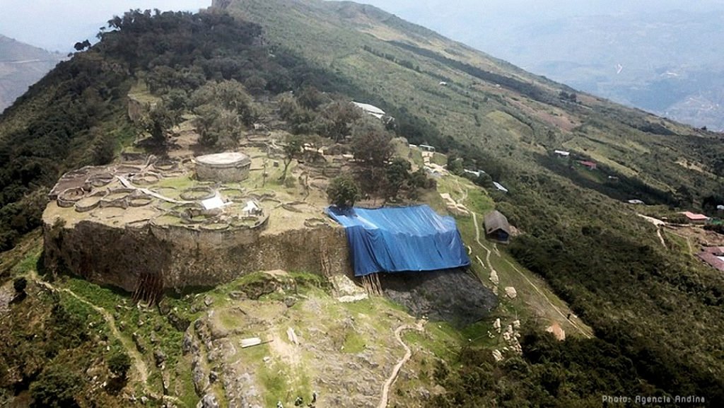 Aerial photo showing the large portion of outer wall collapsed at the pre-Inca fortress temple of Kuelap.