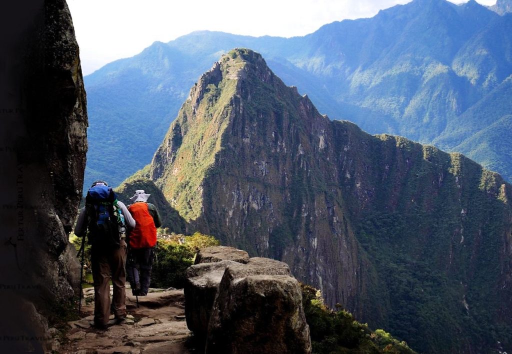 The moment Huayna Picchu comes into view as hiker makes the approach along the Inca Trail to Machu Picchu.