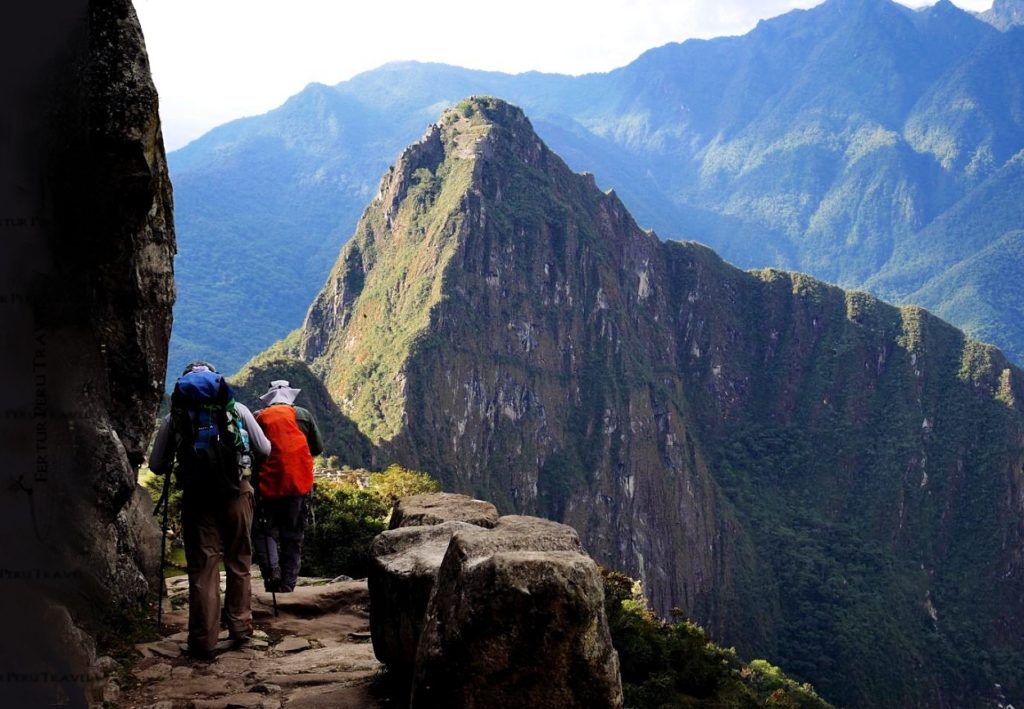 The moment Huayna Picchu comes into view as hiker makes the approach along the Inca Trail to Machu Picchu. 