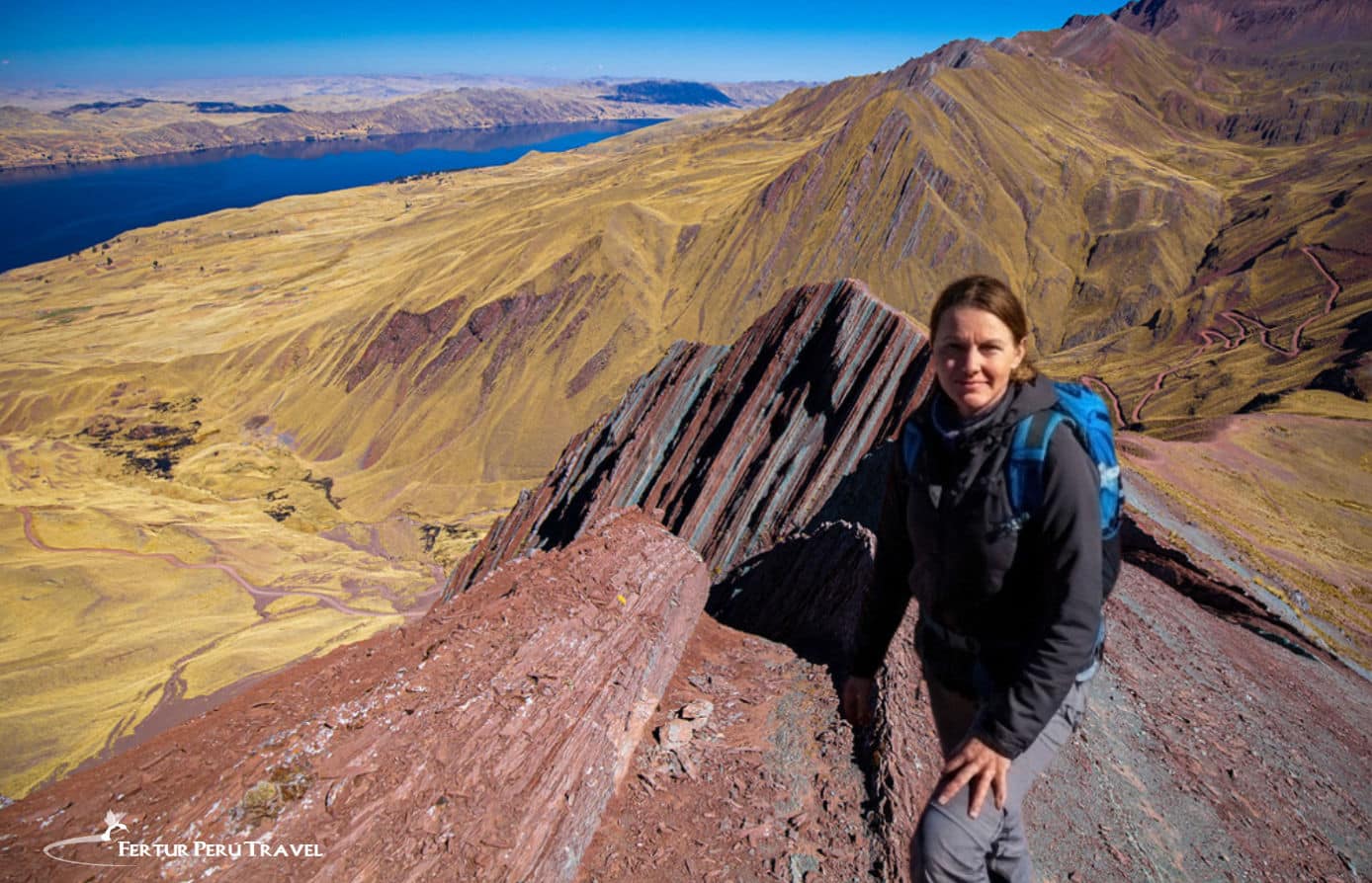 A hiker at the summit of Pallay Punchu in Cusco Peru 