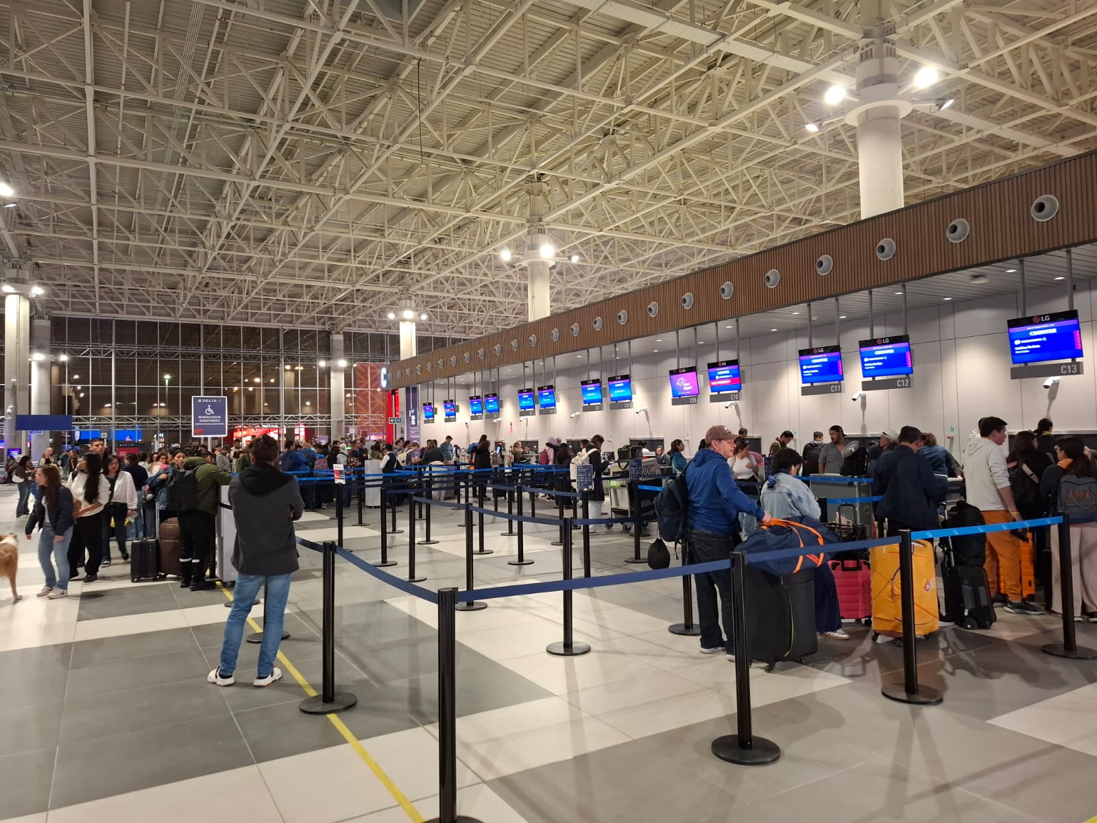 Travelers check in for their flights at Jorge Chavez International Airport in Lima, Peru 