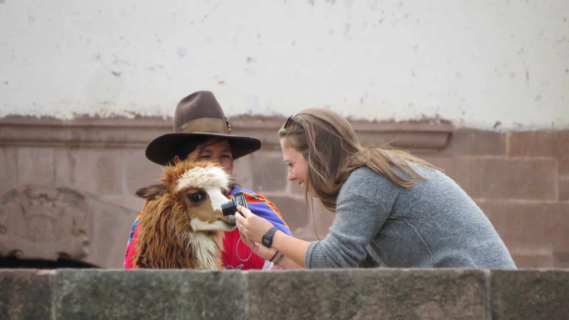 solo-traveler-in-cusco | Peru Travel Blog Independent woman traveler taking photos in Cusco, Peru