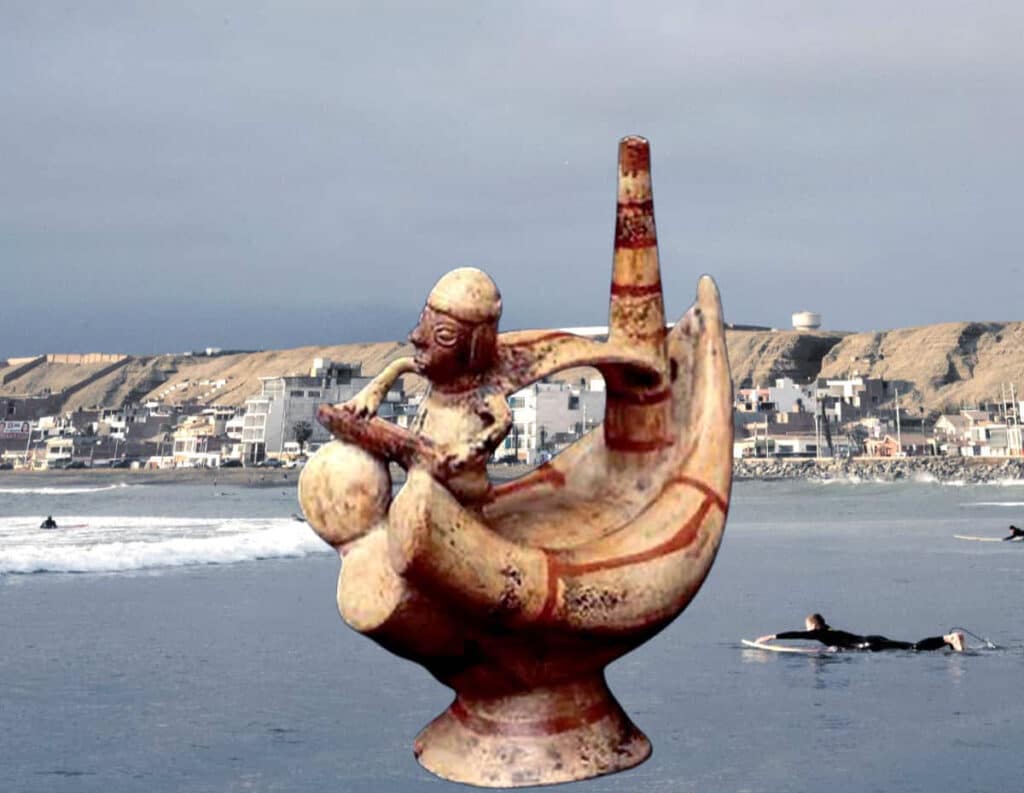 Ancient History of Surfing in Peru — Moche Ceramic Caballito de Totora Vessel | Peru Travel Blog Composite image of an ancient Moche ceramic stirrup-spout vessel depicting a figure riding a caballito de totora reed boat, superimposed over a modern-day surf scene on a Peruvian Pacific coast beach with surfers in the water and a coastal town visible in the background.