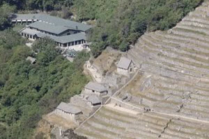Aerial View of the Belmond Sanctuary Lodge at Machu Picchu, Peru | Peru Travel Blog Aerial view of the Belmond Sanctuary Lodge nestled among Inca terraces and cloud forest vegetation at the entrance to Machu Picchu, Cusco, Peru