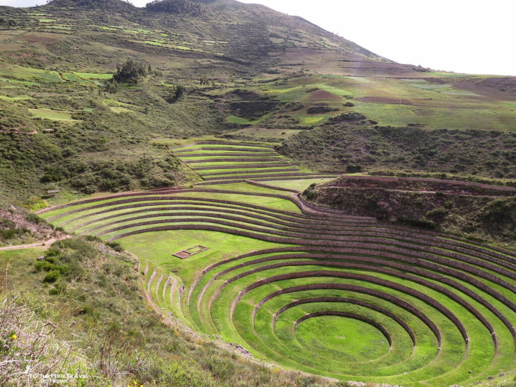 Concentric Circular Inca Agricultural Terraces at Moray, Sacred Valley | Cusco, Peru | Peru Travel Blog A sweeping view of Moray (Muray), one of the most visually extraordinary and scientifically fascinating Inca archaeological sites in the Sacred Valley, located near the village of Maras at approximately 3,500 meters above sea level. The site features a series of concentric circular terraces built into natural depressions in the plateau, the largest descending some 30 meters from rim to floor.
