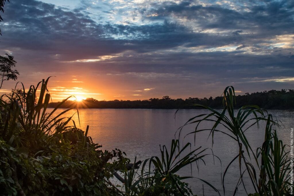 Sunset Over the Tambopata River | Madre de Dios, Peru | Peru Travel Blog Sunset over the Tambopata River in the Madre de Dios region of southeastern Peru, where the river flows through one of the most biodiverse rainforest ecosystems on Earth.