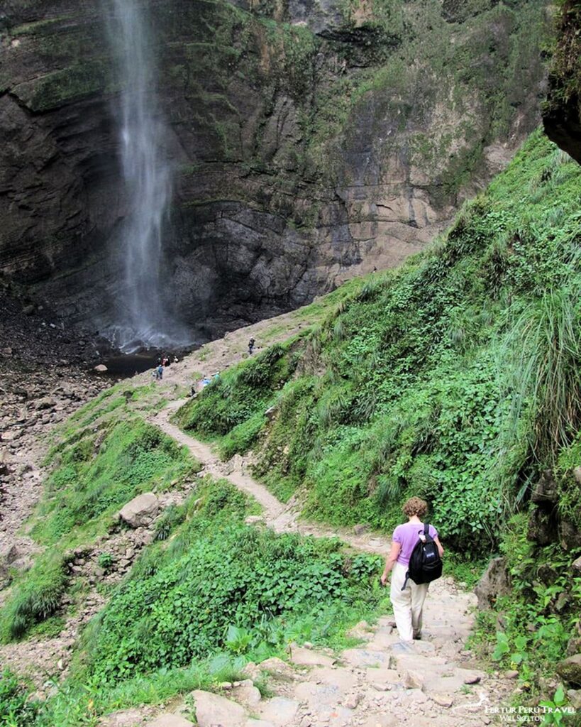 Trekker Descending to the Base and Plunge Pool of Gocta Waterfall, Amazonas, Peru | Peru Travel Blog A Fertur Peru Travel client makes the final descent on a switchback stone trail toward the thundering base of Gocta Falls — one of the tallest waterfalls in the world at 771 meters, located in the Amazonas region of northern Peru near the town of Cocachimba. Photo: Will Skelton.