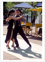 Dancers do a tango at an outdoor cafe in Argentina: 4 Days in Buenos Aires travel package.