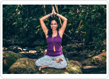 Yoga Retreat Peru Yoga Retreat in Peru: A yoga instructor practicing Holistic Ayurvedic Yoga and Meditation in an idyllic spot by the river at Peru's Amazon Rainforest
