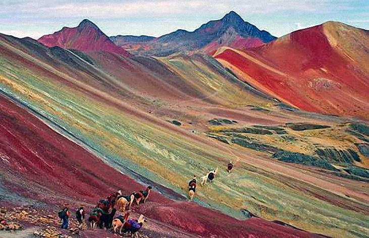 Trekking over Rainbow Mountain, the culminating tour of a four-day Ausangate Mountain Adventure — Cusco Travel Packages