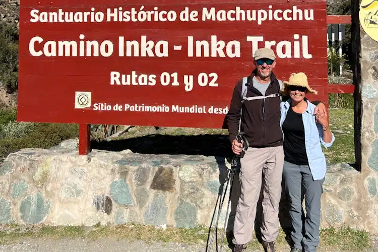 Fertur clients in front of the Camino Inca sign in Cusco about to start the Inca Trail to Machu Picchu