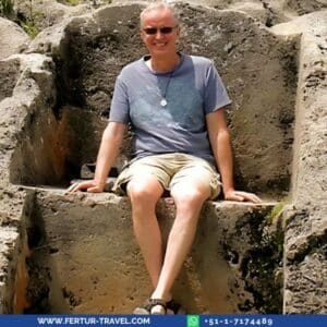 Fertur Peru Travel clients seated on the Inca stone thrones at the Temple of Lightning in Cusco