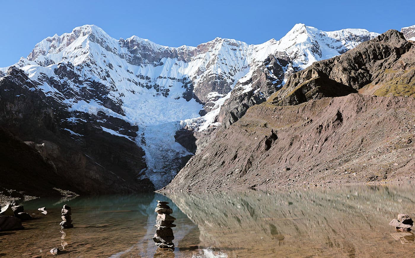 5-day Ausangate Trek Cusco: Hike Peru's sacred mountain circuit. High-altitude adventure, Rainbow Mountain & Machu Picchu. Traditional Andean culture.
