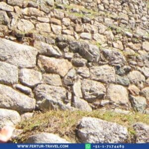 Hikers ascend the Inca Trail through the Winaywayna ruins to Machu Picchu