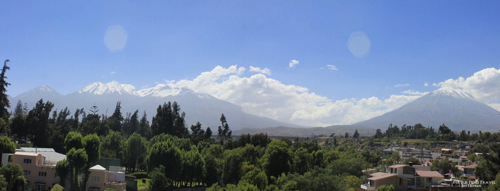 Panoramic view of the city of Arequipa, Peru, featuring the iconic volcanoes that surround the 