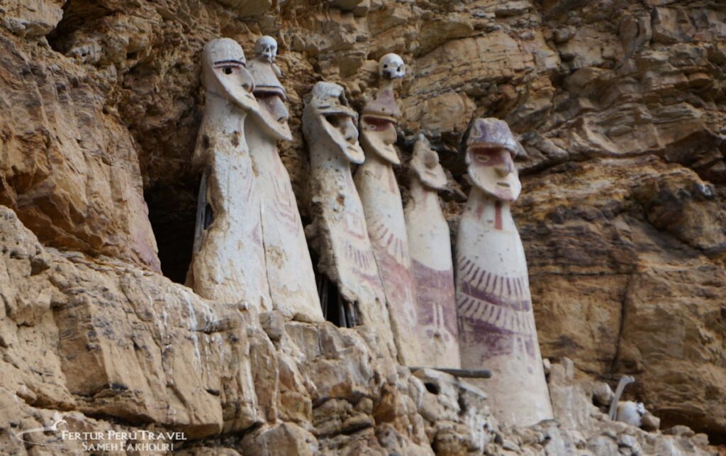 The Sarcophagi of Karajía, eight imposing pre-Columbian funerary figures crafted by the Chachapoya culture and placed high on a cliff ledge in the Amazonas region of northern Peru