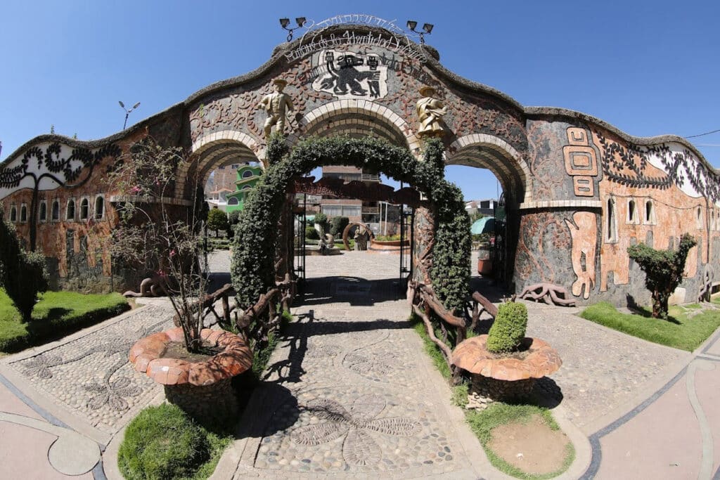 Ornate stone archway and sculpted walkway at Parque de la Identidad Wanka, a cultural park celebrating Huanca heritage in Huancayo, Peru