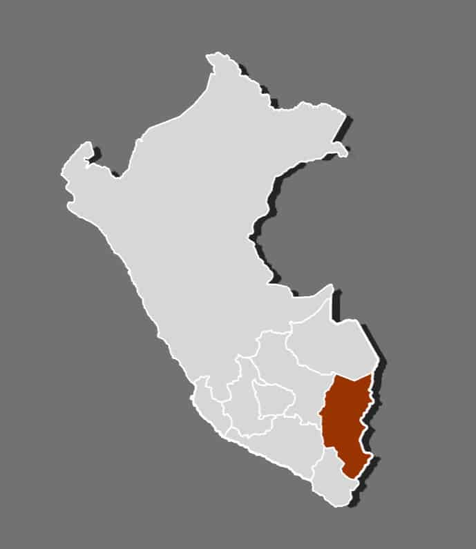 Outline map of Peru with the Puno region highlighted in dark brown, located in the southeastern part of the country, bordering Bolivia and Lake Titicaca.